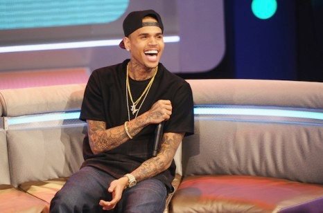 Chris-Brown-wears-Rhude-T-shirt-Acne-Jeans-and-Air-Jordan-Retro-13-Sneakers-on-BET-106-Park-4-466x308