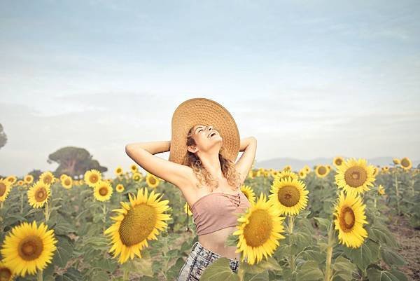 woman-standing-on-sunflower-field-3764579.jpg