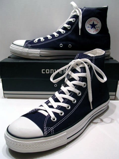 A_classic_Black_pair_of_Converse_All_Stars_resting_on_the_Black_&amp;_White_Ed__Shoebox_(1998-2002).jpg