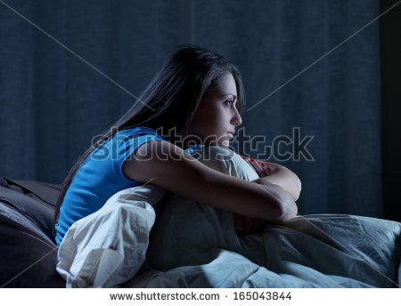 stock-photo-portrait-of-a-young-woman-suffering-from-insomnia-165043844.jpg