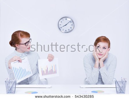 stock-photo-conscientious-and-distracted-office-worker-sitting-at-desk-543430285.jpg