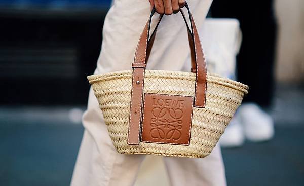 guest-wears-a-loewe-woven-straw-bag-during-london-fashion-news-photo-1585572121.jpg