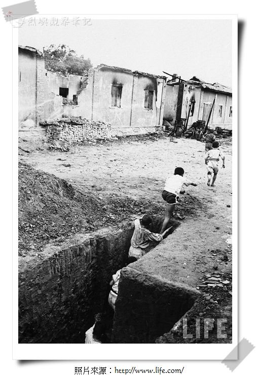 Children in Kwang Li village, play follow the leader in real trenches.jpg