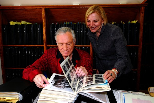 Hugh Hefner and Director Brigitte Berman in the scrapbook office at the Los Angeles Playboy Mansion by Elayne Lodge.JPG