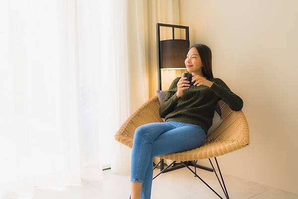 portrait-beautiful-young-asian-woman-hold-coffee-cup-sitting-sofa-chair.jpg