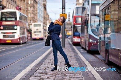 pretty-girl-walking-on-the-road-100245783