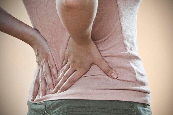 back-pain-woman-holding-back