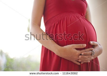 stock-photo-image-of-pregnant-woman-touching-her-belly-with-hands-111643082.jpg